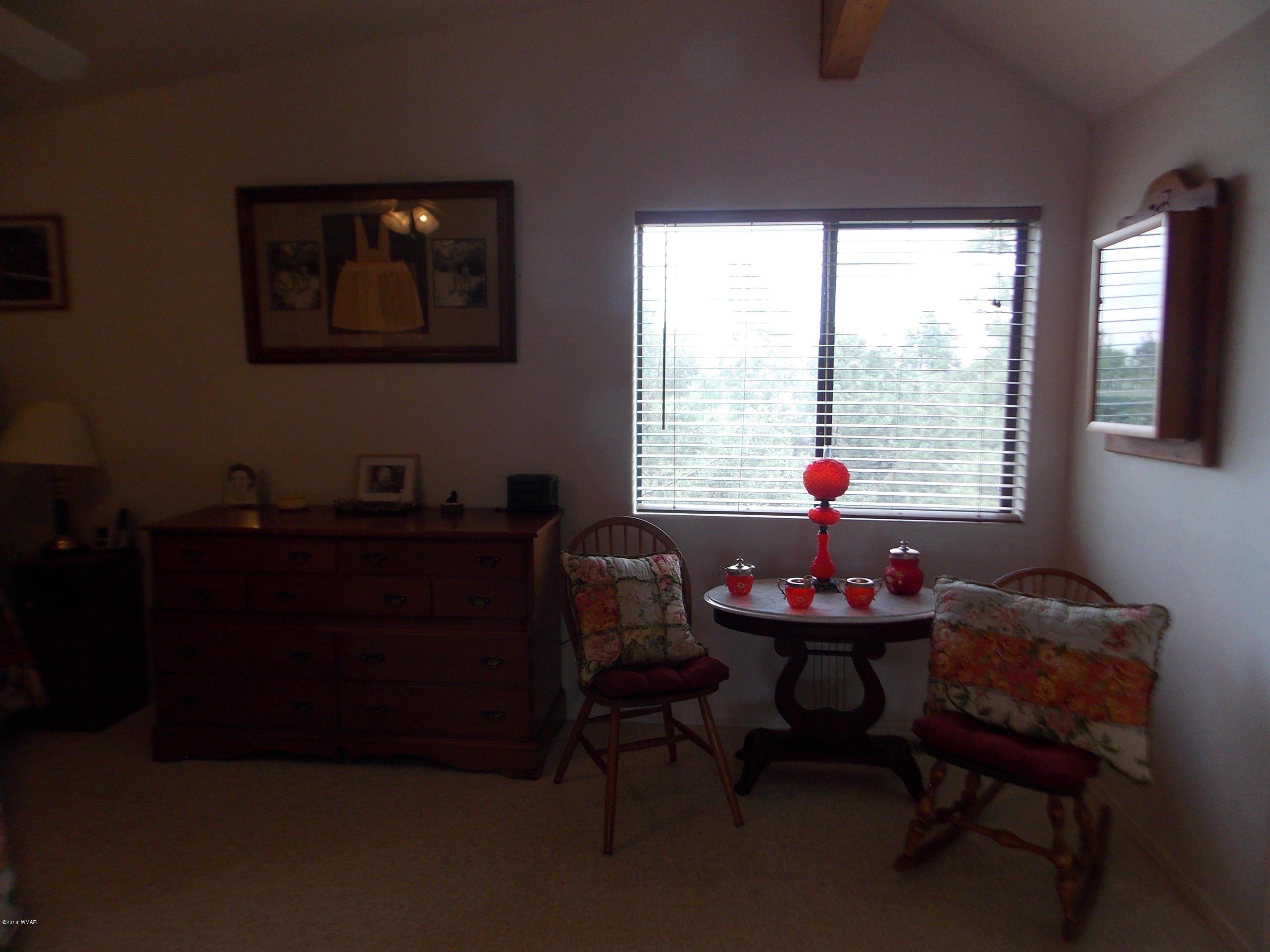 2296 Sunrise Road Overgaard, AZ 85933 - Photo 23 of 66 a living room with furniture and a window