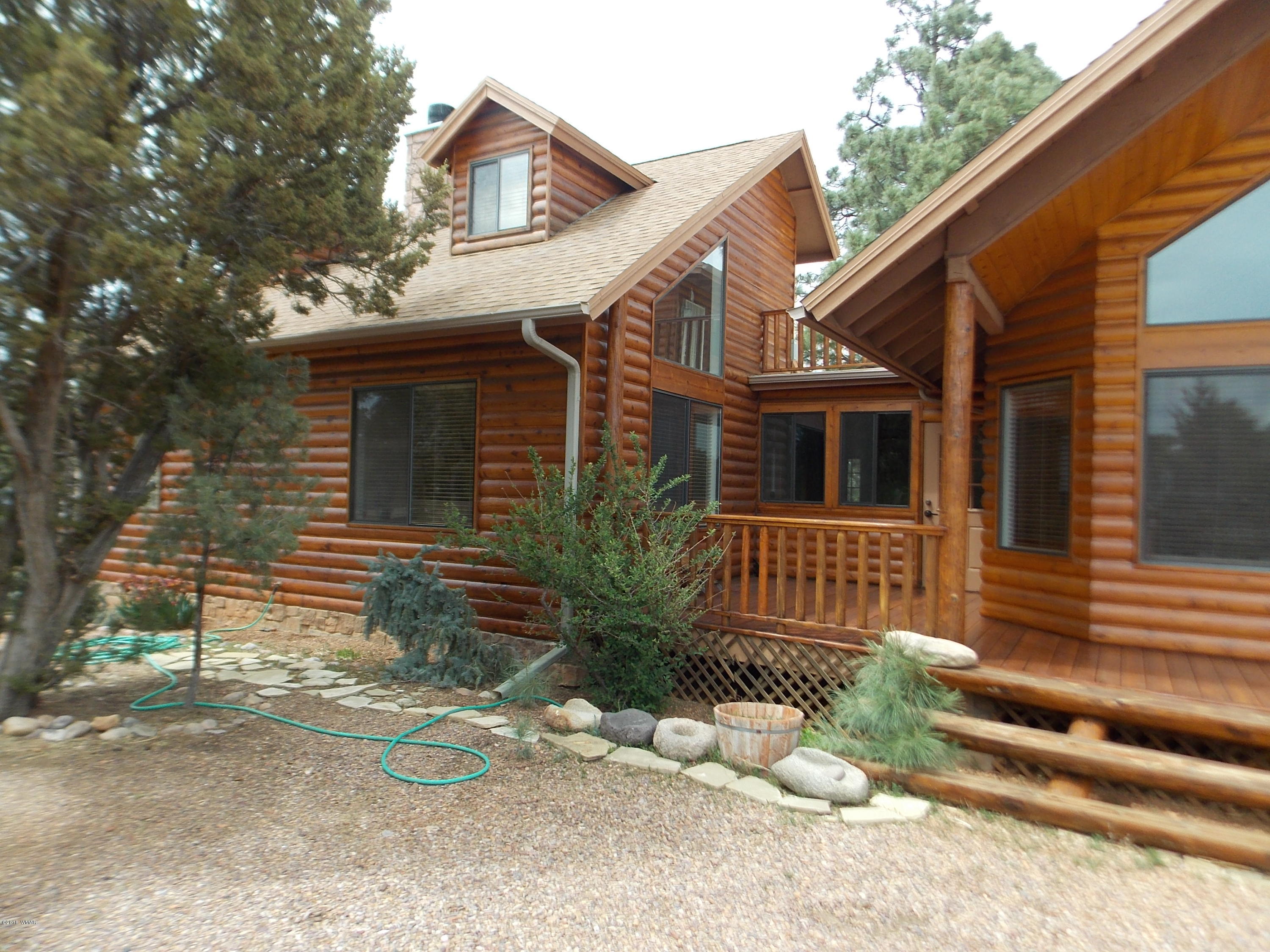 2296 Sunrise Road Overgaard, AZ 85933 - Photo 49 of 66 a view of a house with a yard