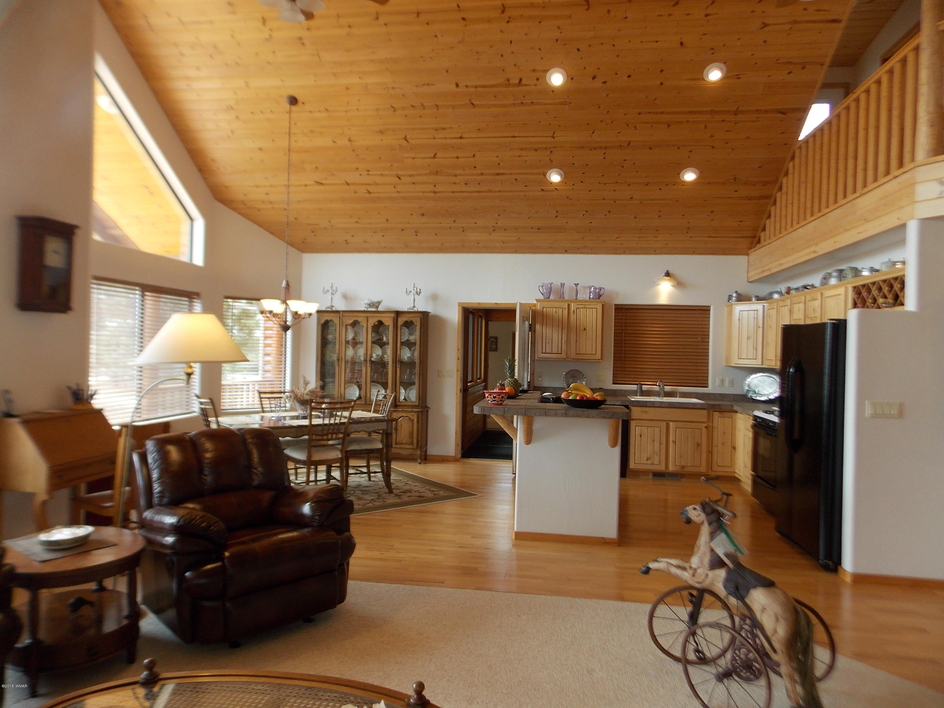 2296 Sunrise Road Overgaard, AZ 85933 - Photo 6 of 66 a living room with lots of furniture and a window