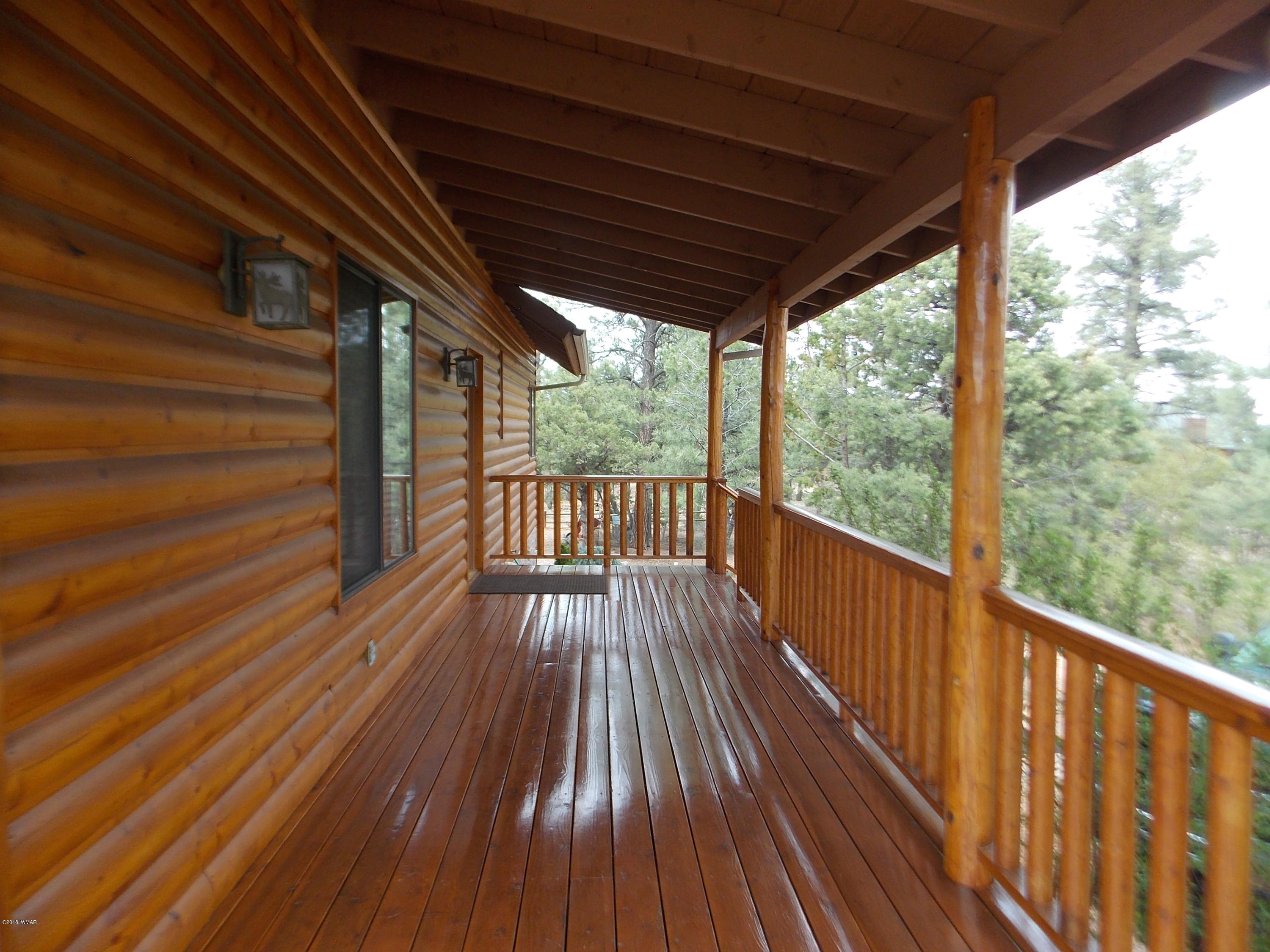 2296 Sunrise Road Overgaard, AZ 85933 - Photo 64 of 66 a view of balcony with wooden floor