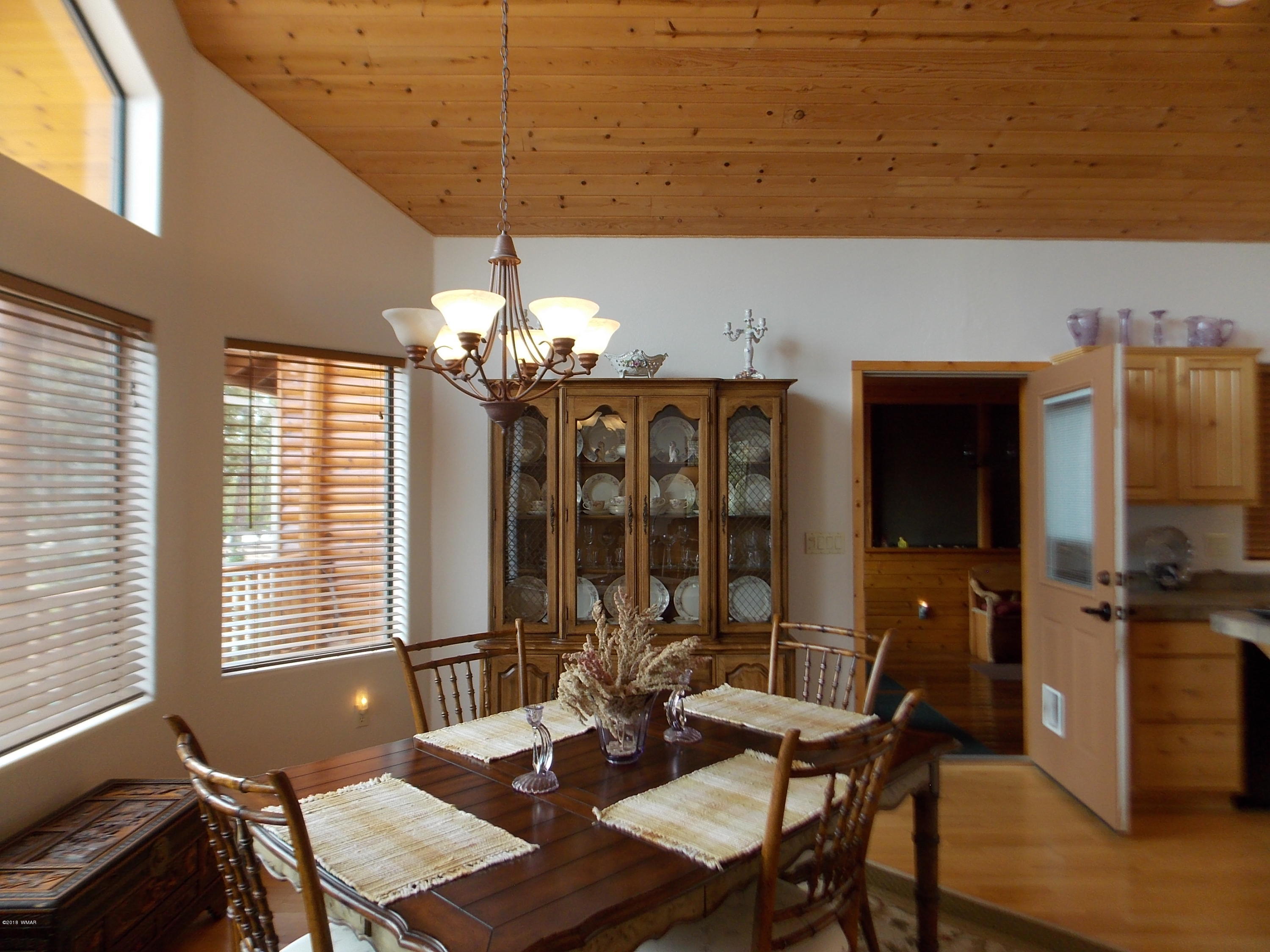 2296 Sunrise Road Overgaard, AZ 85933 - Photo 8 of 66 a view of a dining room with furniture and window