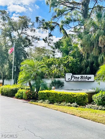 a sign that is sitting on a brick wall