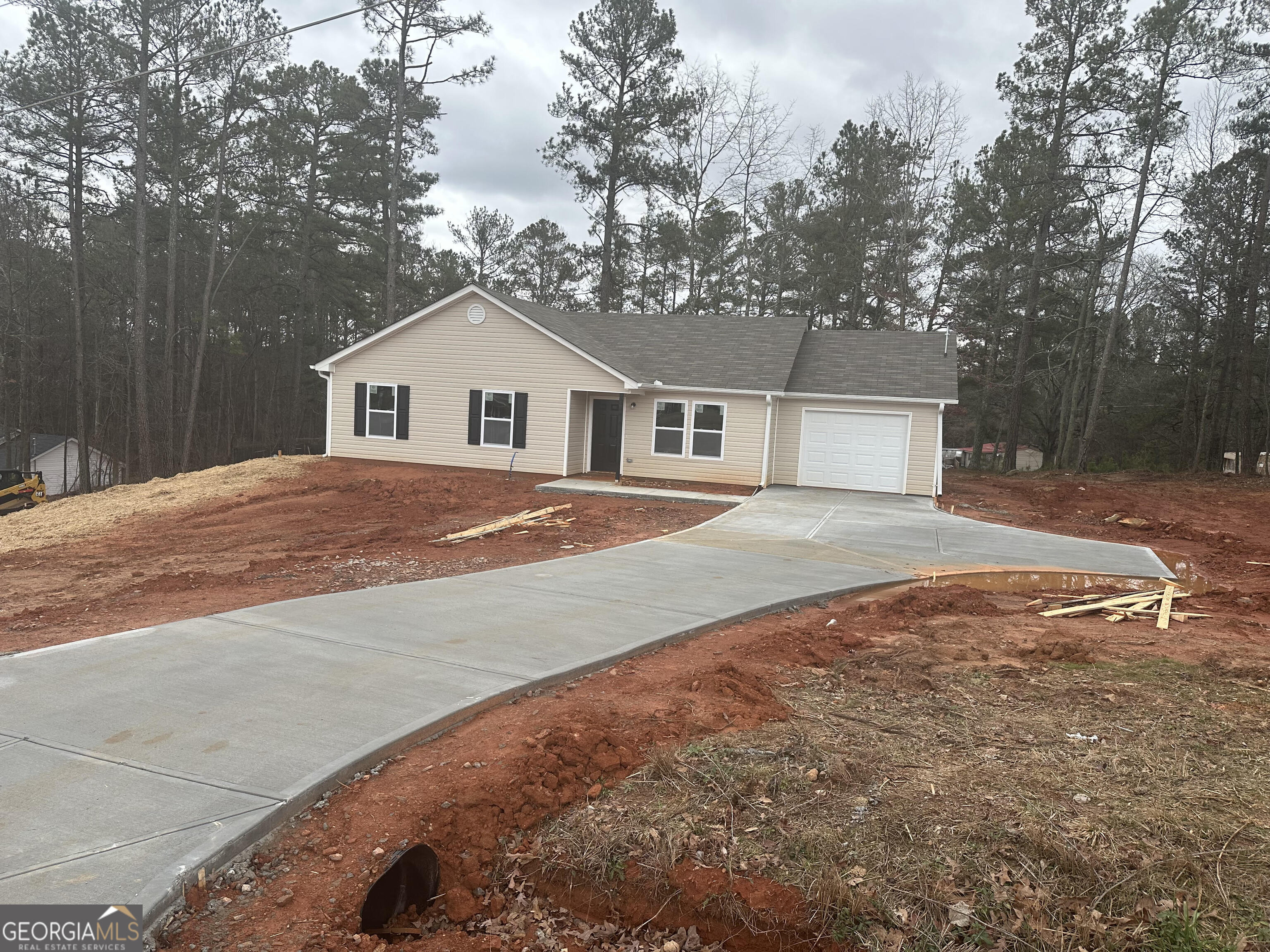 174 West Liberty Road Villa Rica, GA 30180 - Photo 1 of 1 a front view of a house with a yard and trees