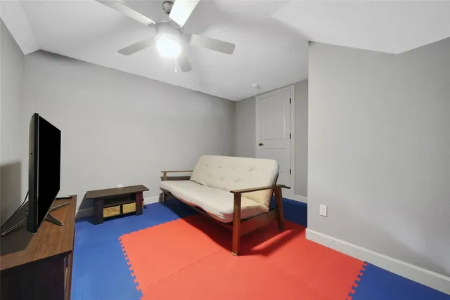 a view of walk in closet with clothes
