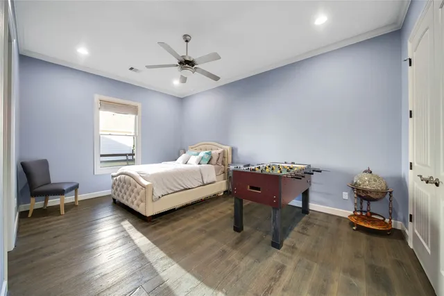 a view of a dining room with furniture large windows and wooden floor