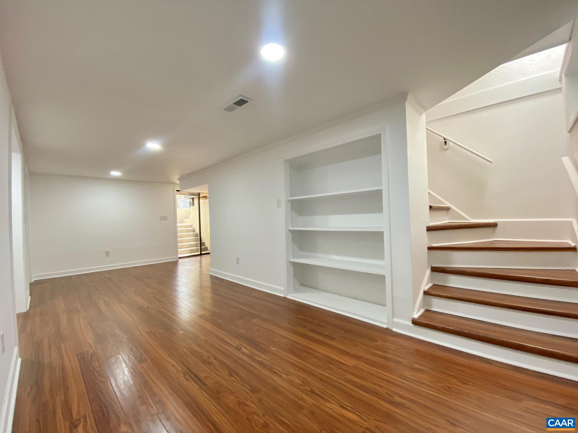 24 Tanglewood Road Palmyra, VA 22963 - Photo 18 of 23 a view of an empty room with wooden floor and a window