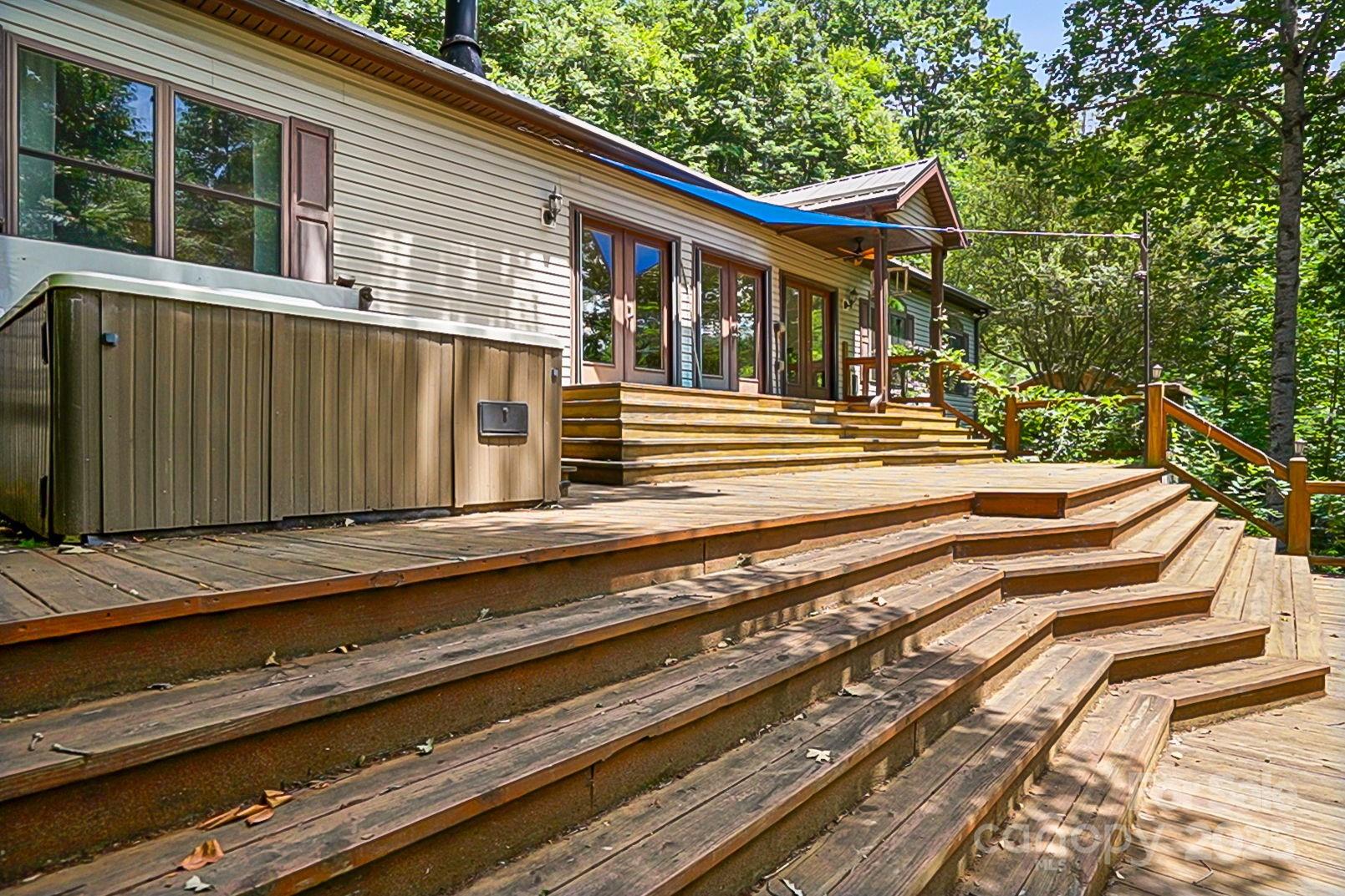 28 Back Stage Pass Leicester, NC 28748 - Photo 4 of 48 a view of a house with a balcony and wooden fence