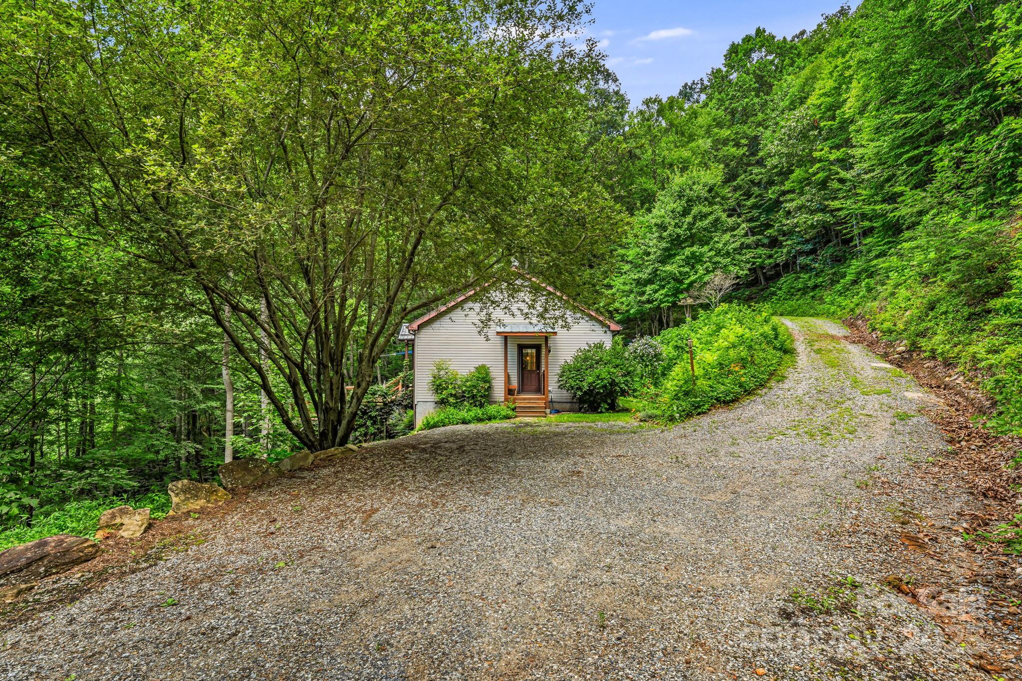 28 Back Stage Pass Leicester, NC 28748 - Photo 8 of 48 a house with a tree in front of it