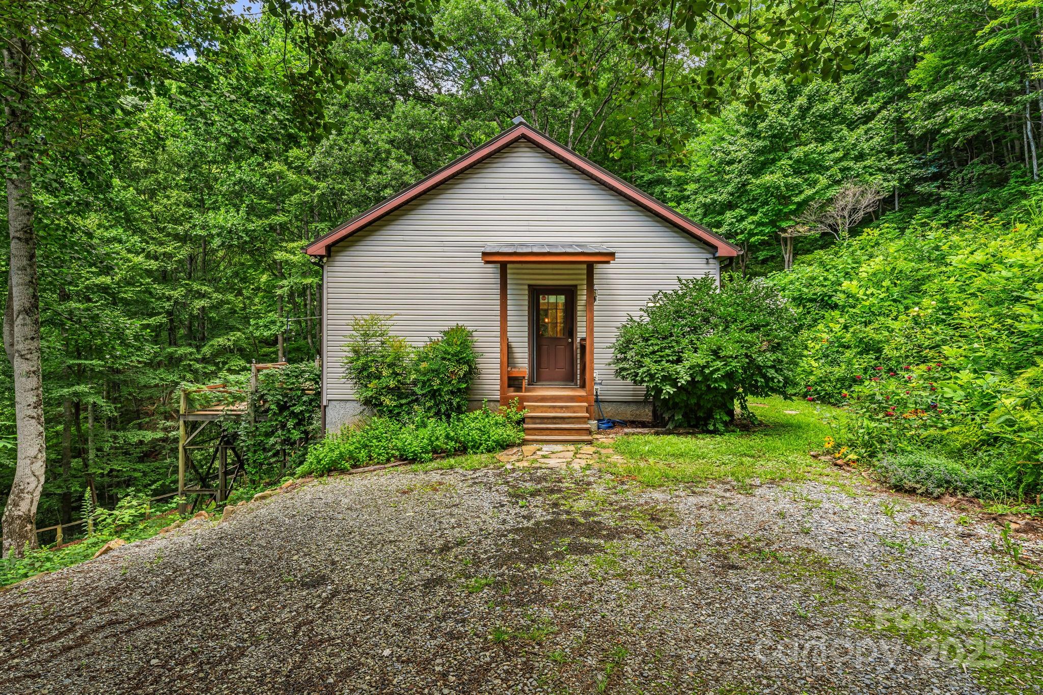 28 Back Stage Pass Leicester, NC 28748 - Photo 9 of 48 a view of a house with yard and plants