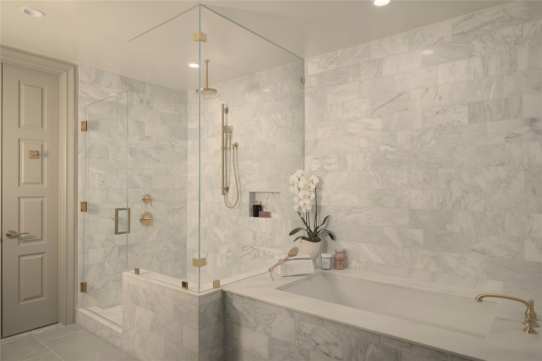 1717 Bissonnet Street, Unit 808 Houston, TX 77005 - Photo 19 of 35 Seamless marble slab tub surround and an oversized marble shower with bench. Floor to ceiling marble surround.