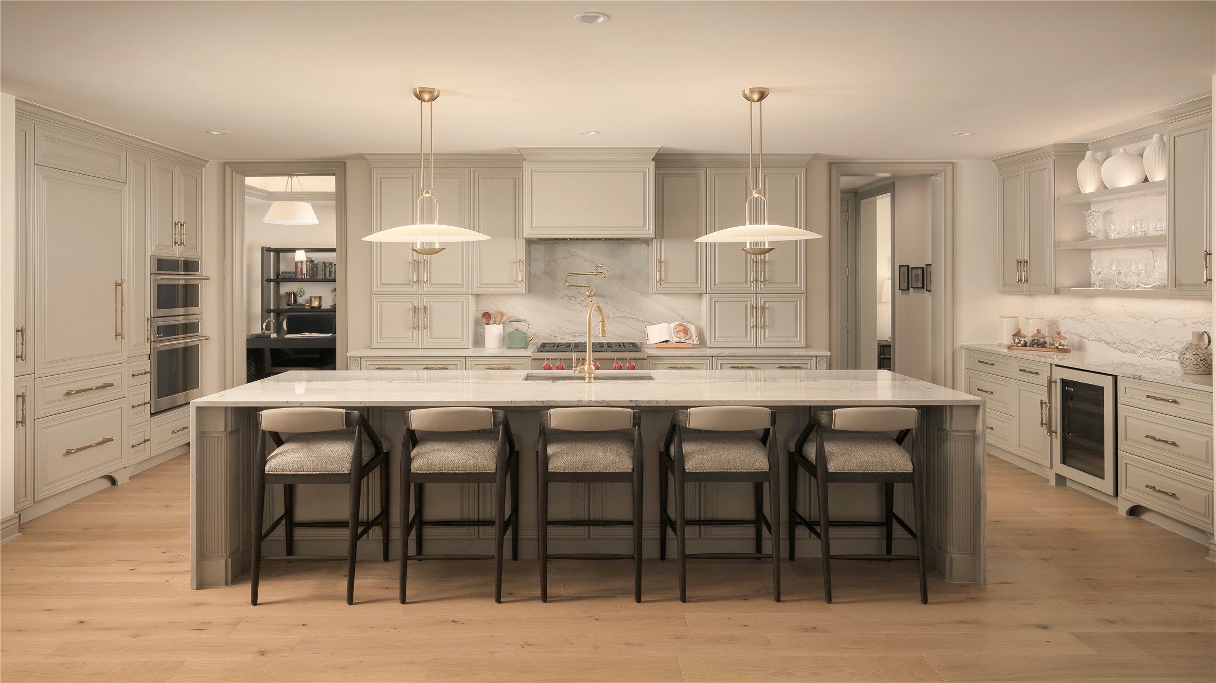 Beautiful wide plank hardwoods throughout, Quartzite waterfall island and counter tops, built in panel front refrigerator and Advantium microwave/oven combination.
