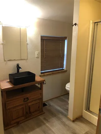 a room with a chair and a mirror