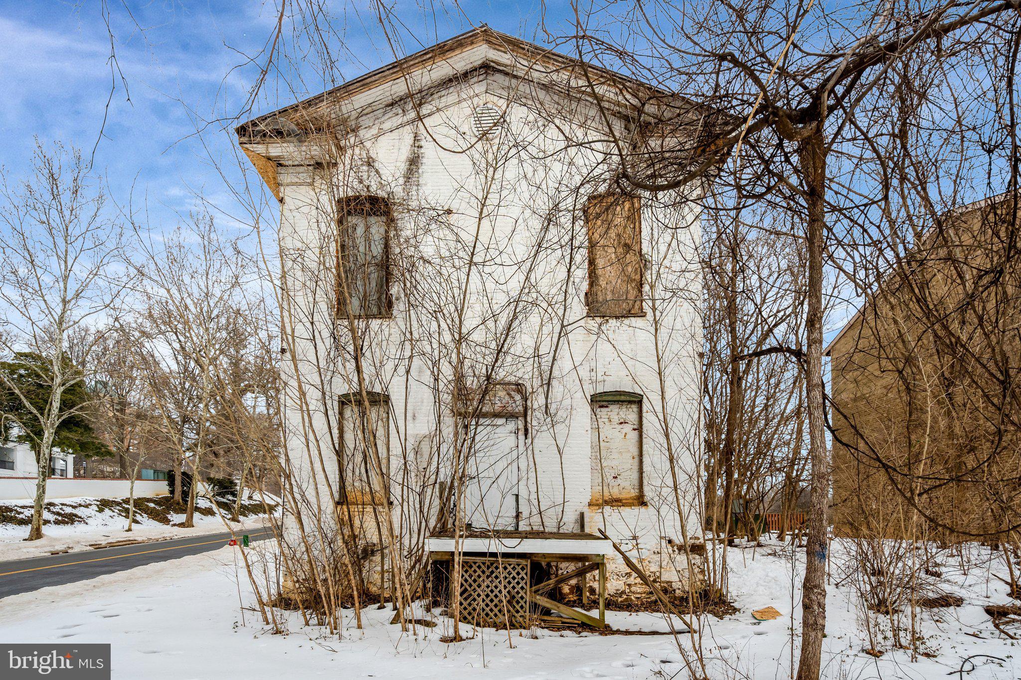 1865 Old Reston Avenue Reston, VA 20190 - Photo 2 of 5 a front view of a house with trees