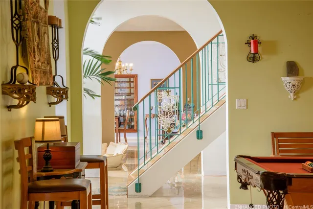 a view of entryway and hall with a front door