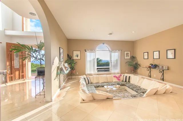 a living room with a large window and a table