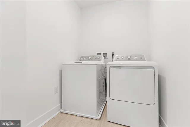 an empty room with a empty space and windows