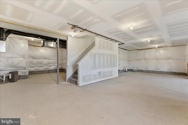 a view of an empty room with white walls