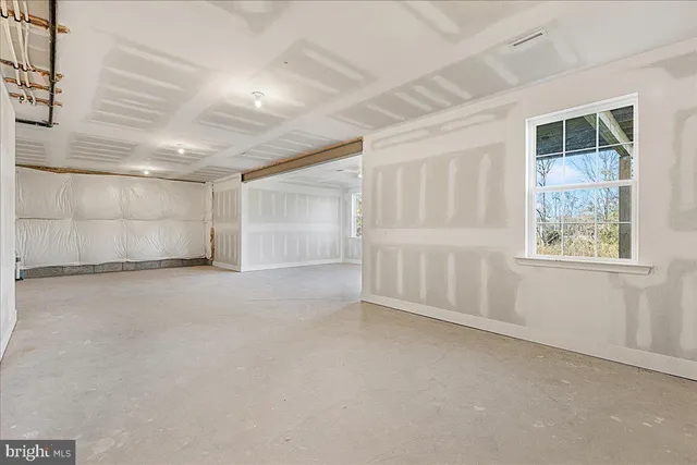 a view of a porch with wooden floor and a window