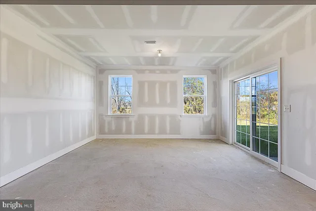 a view of balcony with wooden floor and fence