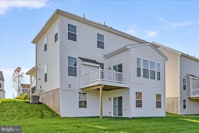 a kitchen with stainless steel appliances a sink a counter top space cabinets and stainless steel appliances