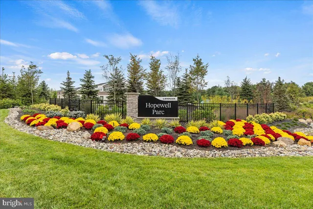 a kitchen with a table chairs refrigerator and microwave