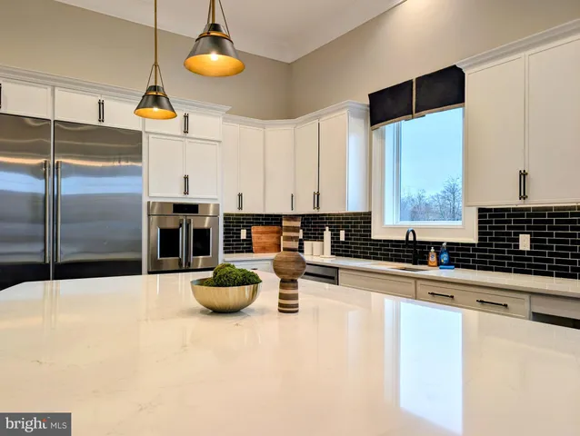 a room with lots of furniture and a large window