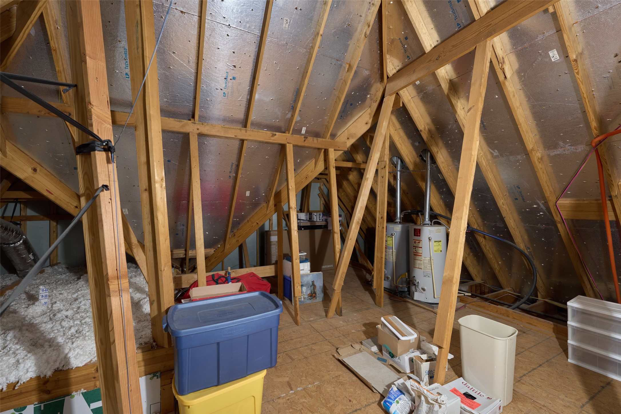 2706 Berners-Lee Avenue Spring, TX 77381 - Photo 37 of 43 There are two separate attic spaces. This one is huge and for storage. The water heaters are in this space. The other one houses the furnaces. Notice the radiant barrier :)