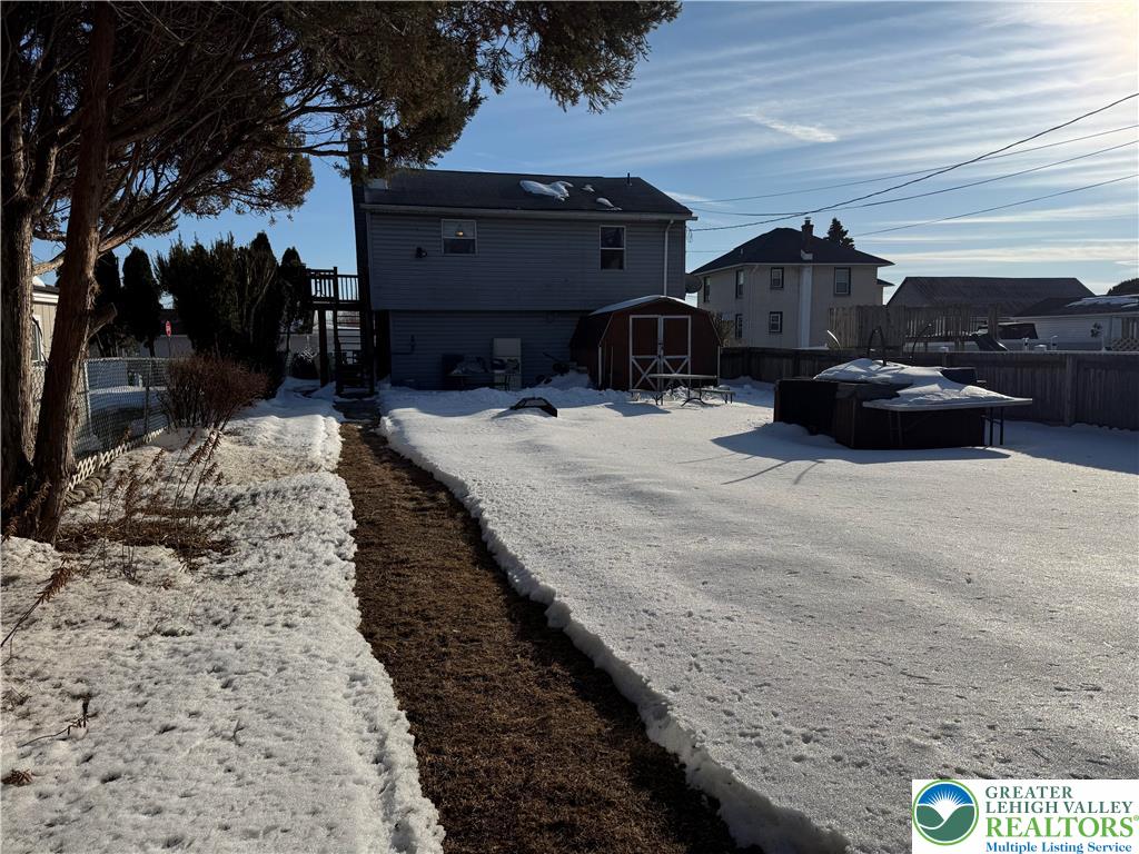 702 West Locker Street Nazareth, PA 18064 - Photo 12 of 12 a view of a house with a yard covered in snow