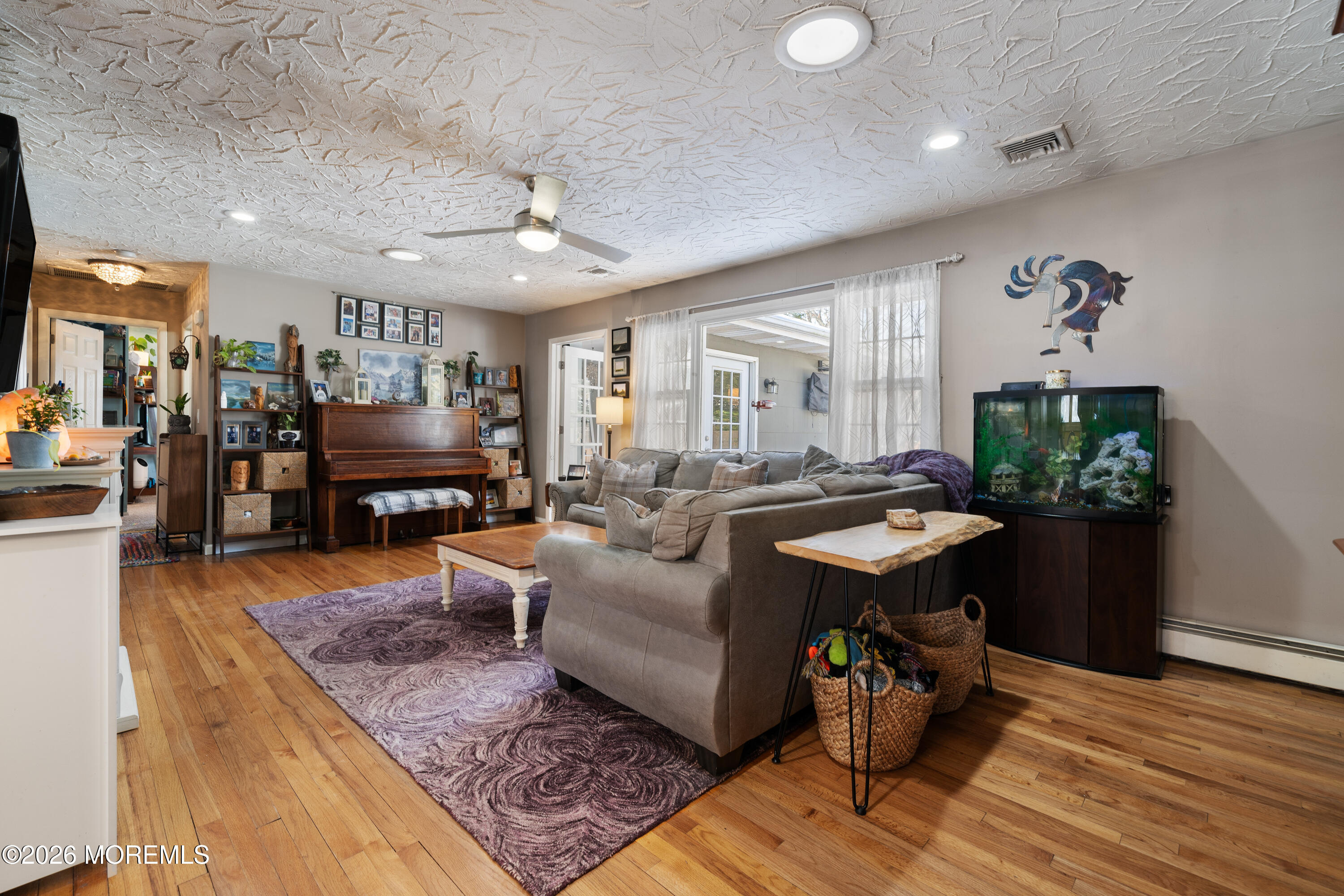 330 Riviera Drive Forked River, NJ 08731 - Photo 24 of 32 a living room with furniture and a flat screen tv