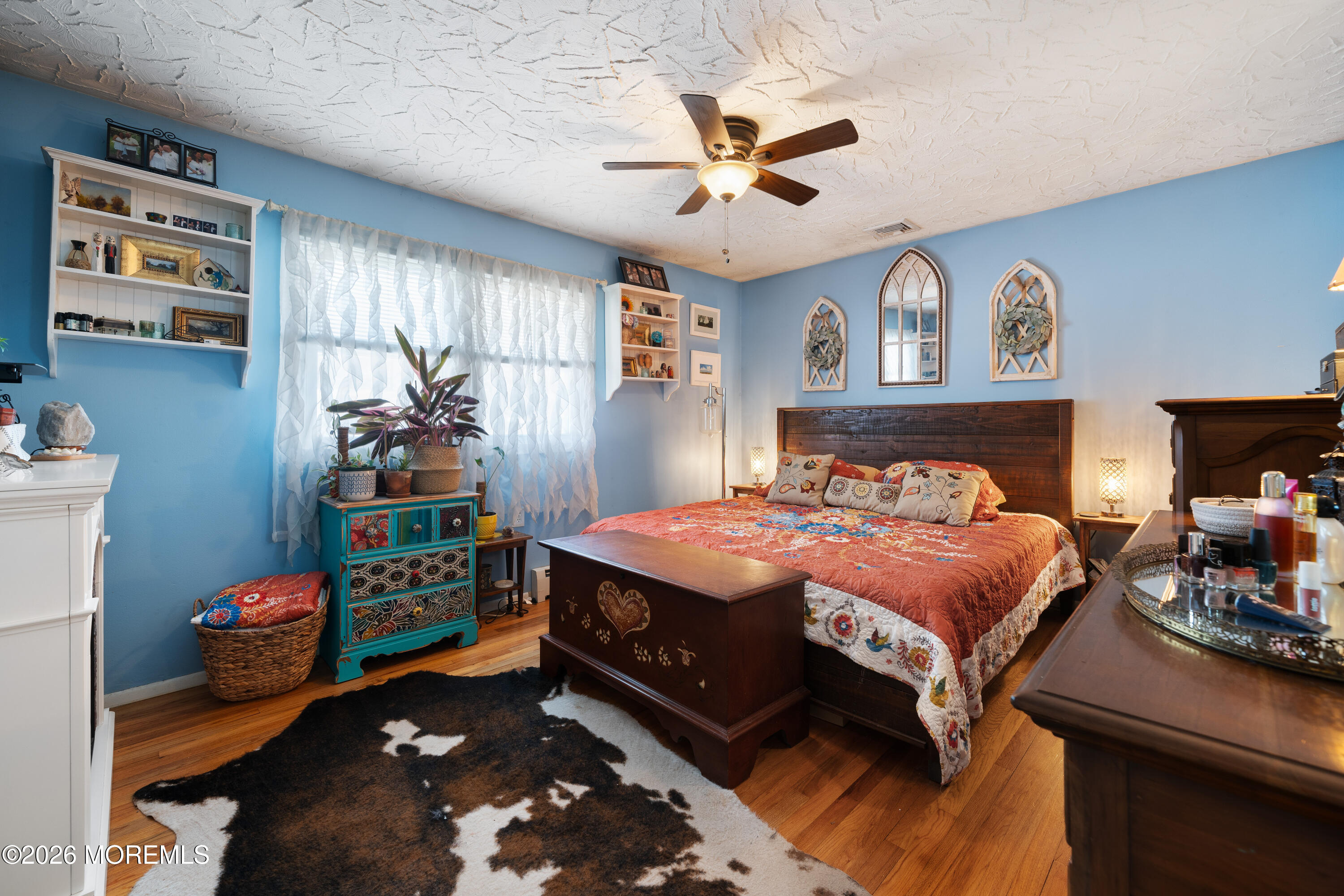 330 Riviera Drive Forked River, NJ 08731 - Photo 26 of 32 a bedroom with a bed and a chandelier