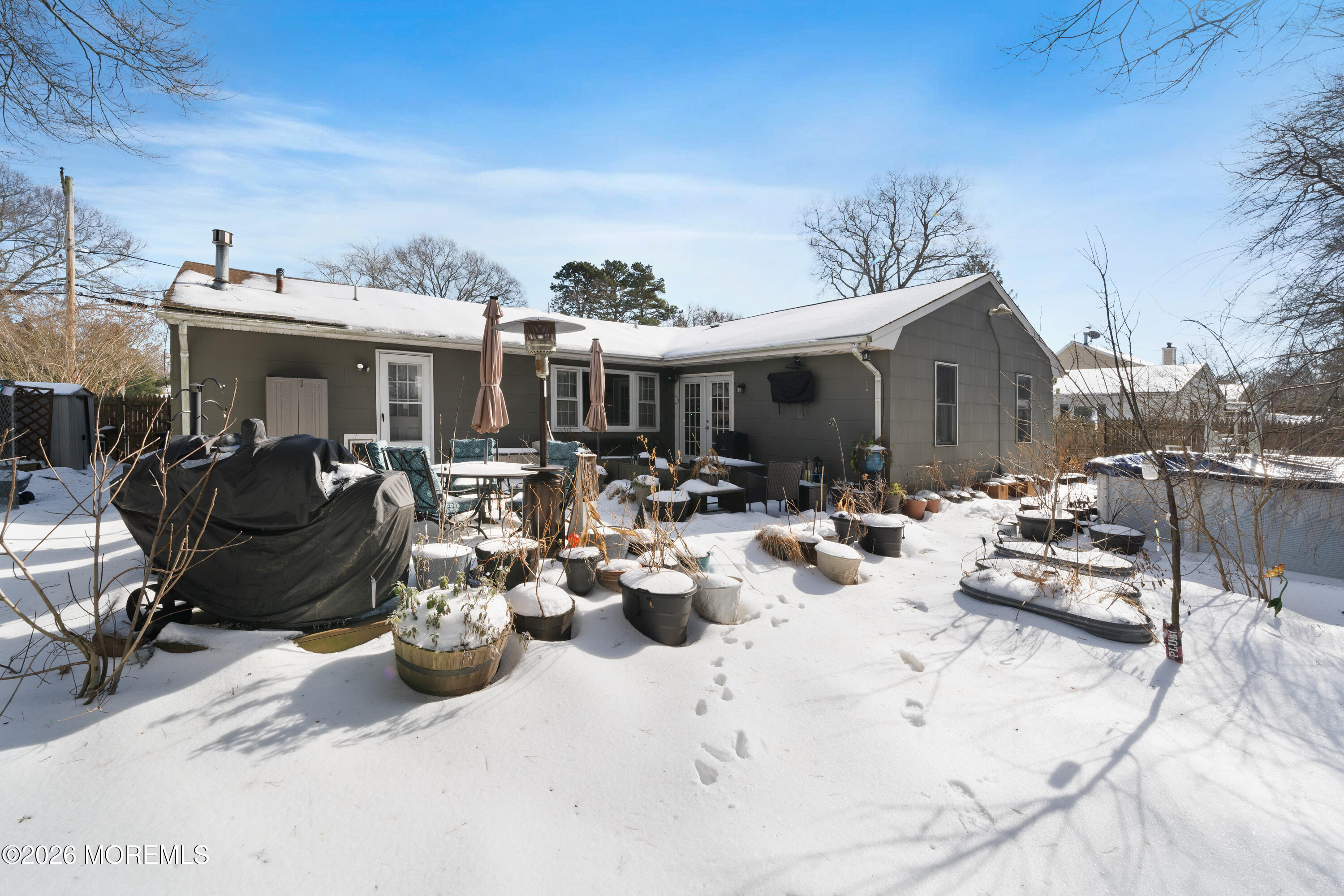 330 Riviera Drive Forked River, NJ 08731 - Photo 27 of 32 a view of a patio with dining table and chairs with plants