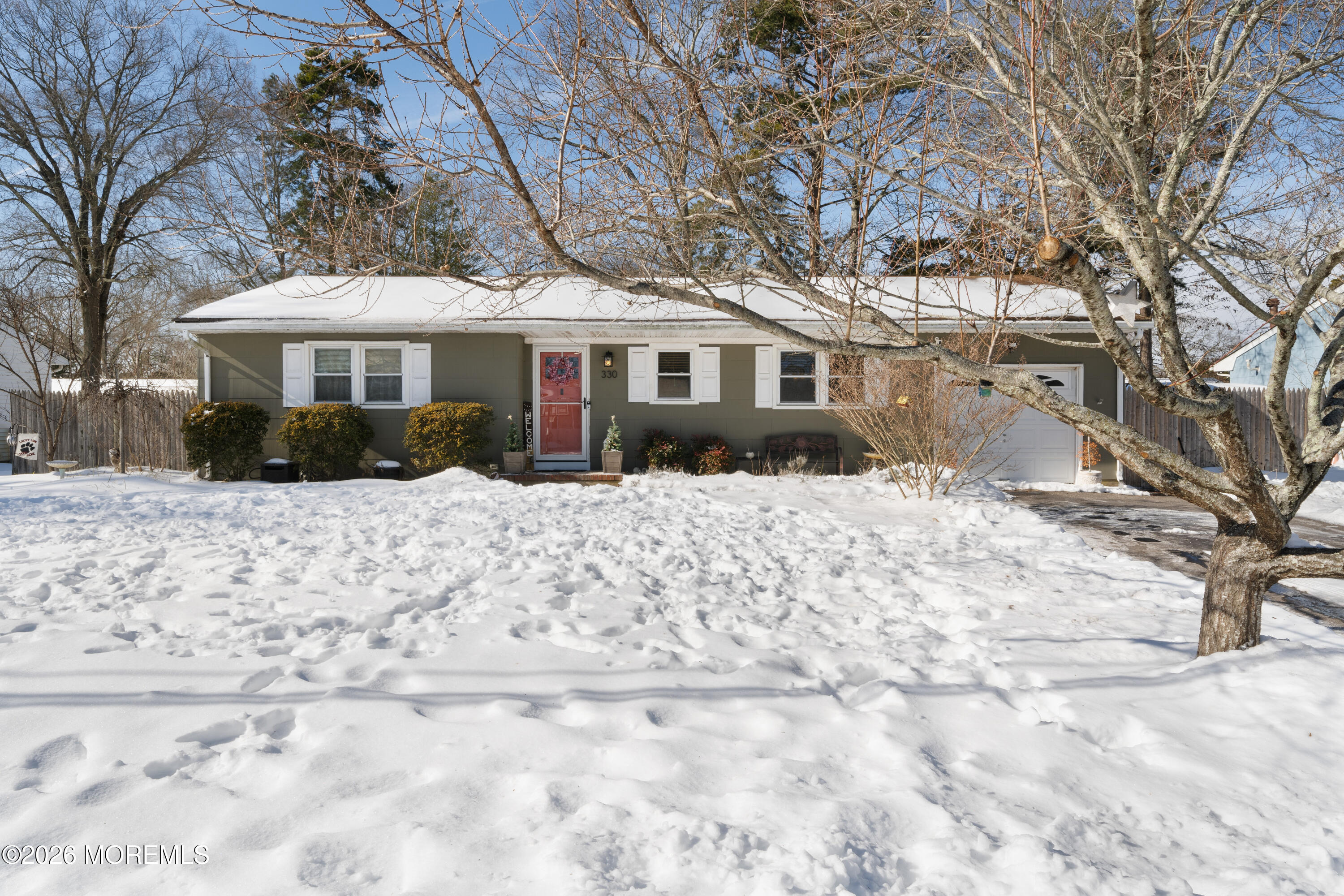 330 Riviera Drive Forked River, NJ 08731 - Photo 28 of 32 a front view of a house with a yard covered in snow