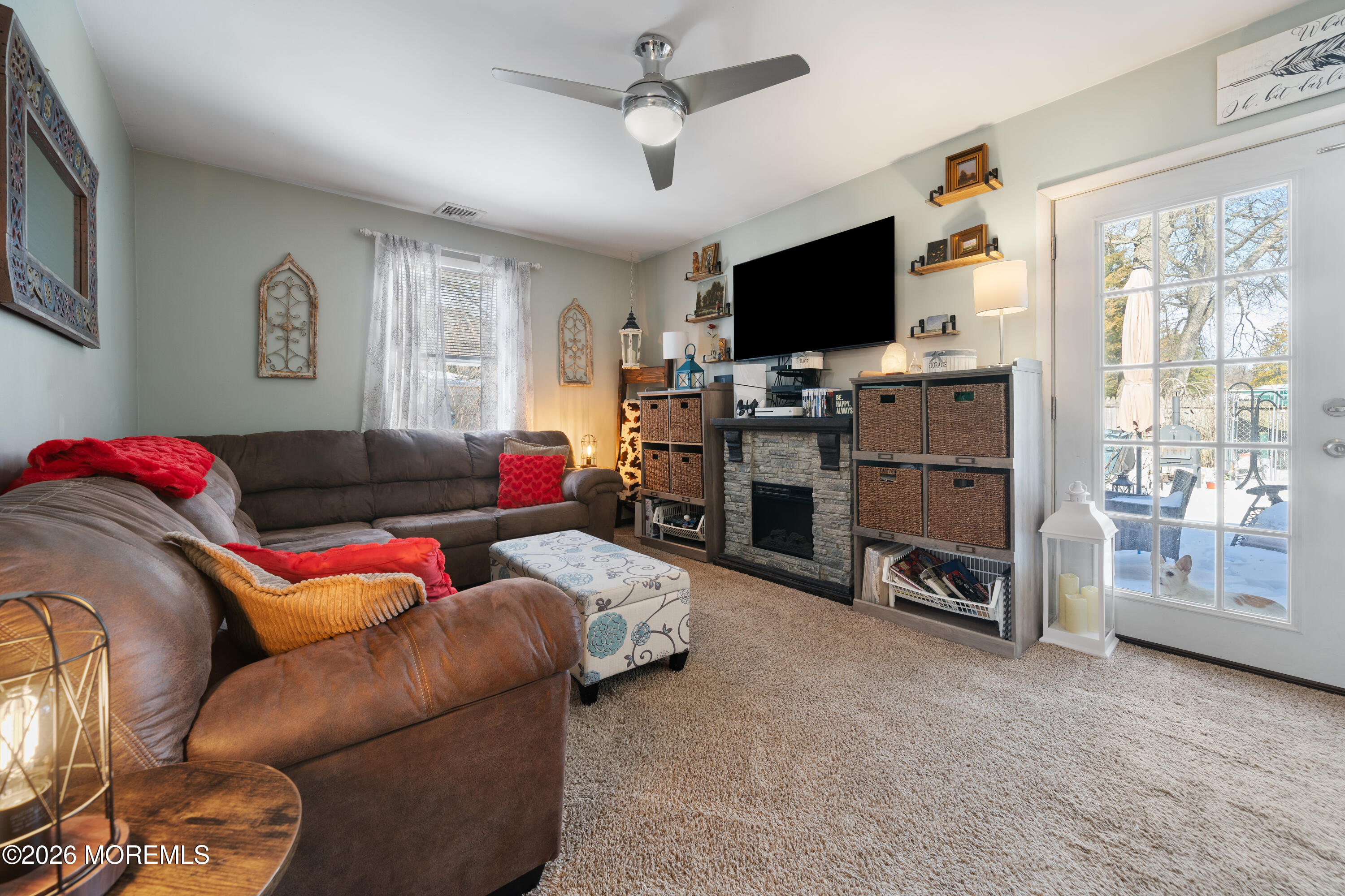 330 Riviera Drive Forked River, NJ 08731 - Photo 5 of 32 a living room with furniture and a flat screen tv