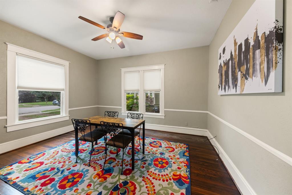 5502 Victor Street Dallas, TX 75214 - Photo 12 of 22 a dining room with wooden floor and a table