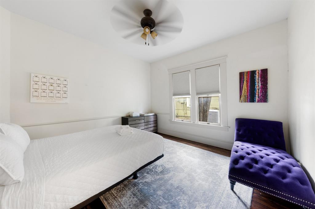 5502 Victor Street Dallas, TX 75214 - Photo 13 of 22 a bedroom with a bed couch and window