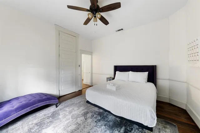 a bedroom with a bed and a dresser