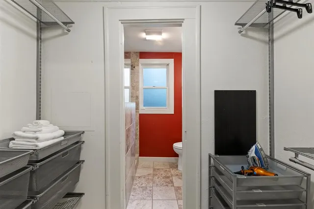 a view of a hallway with closet