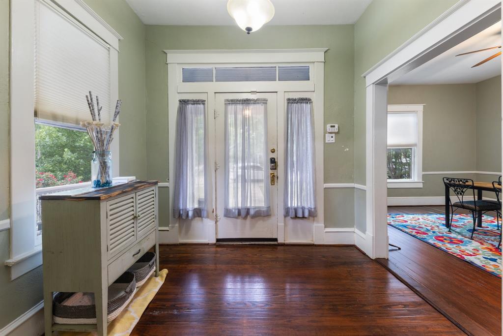 5502 Victor Street Dallas, TX 75214 - Photo 5 of 22 a view of entryway with wooden floor and furniture