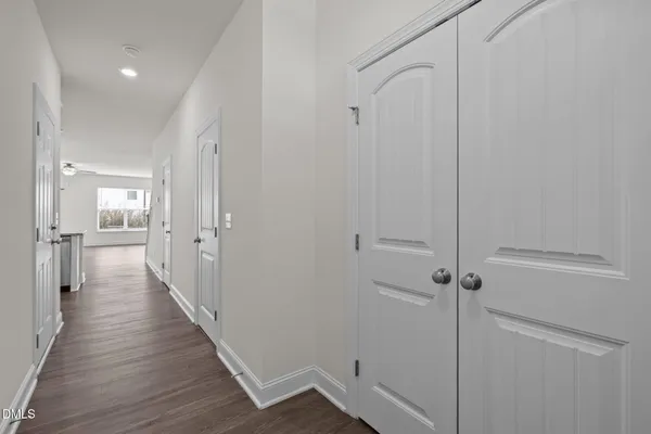 a view of a hallway with a wooden floor