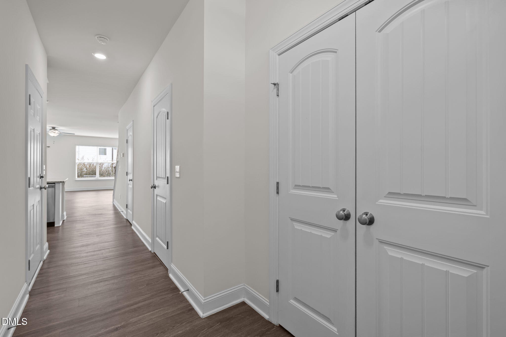 1033 Heartstone Way Durham, NC 27713 - Photo 18 of 26 a view of a hallway with a wooden floor