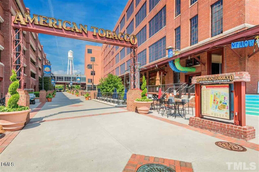 1033 Heartstone Way Durham, NC 27713 - Photo 26 of 26 a view of street with large building and large windows