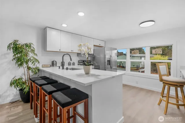 a kitchen with a sink and stove