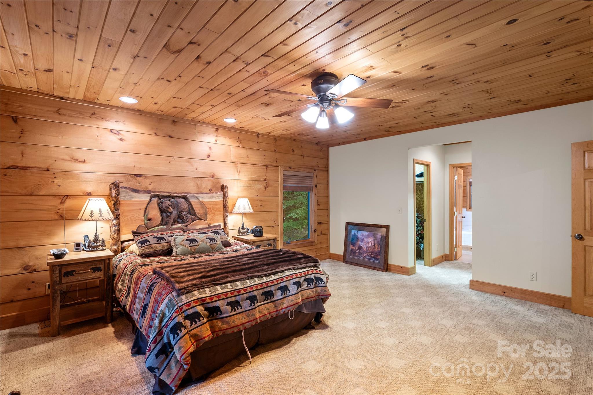 12215 Big Laurel Road Marshall, NC 28753 - Photo 12 of 44 a bedroom with a bed and a fireplace