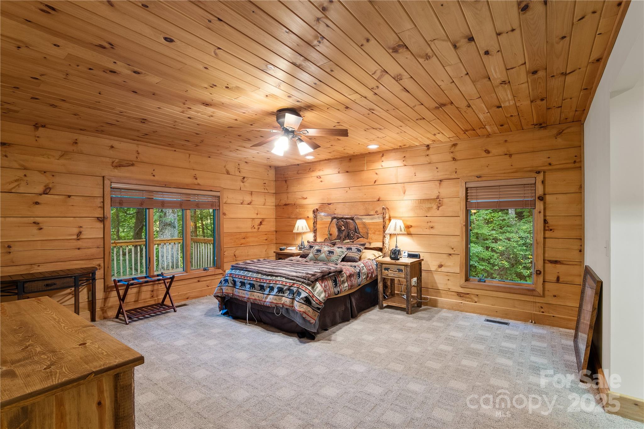 12215 Big Laurel Road Marshall, NC 28753 - Photo 13 of 44 a spacious bedroom with a bed and large windows