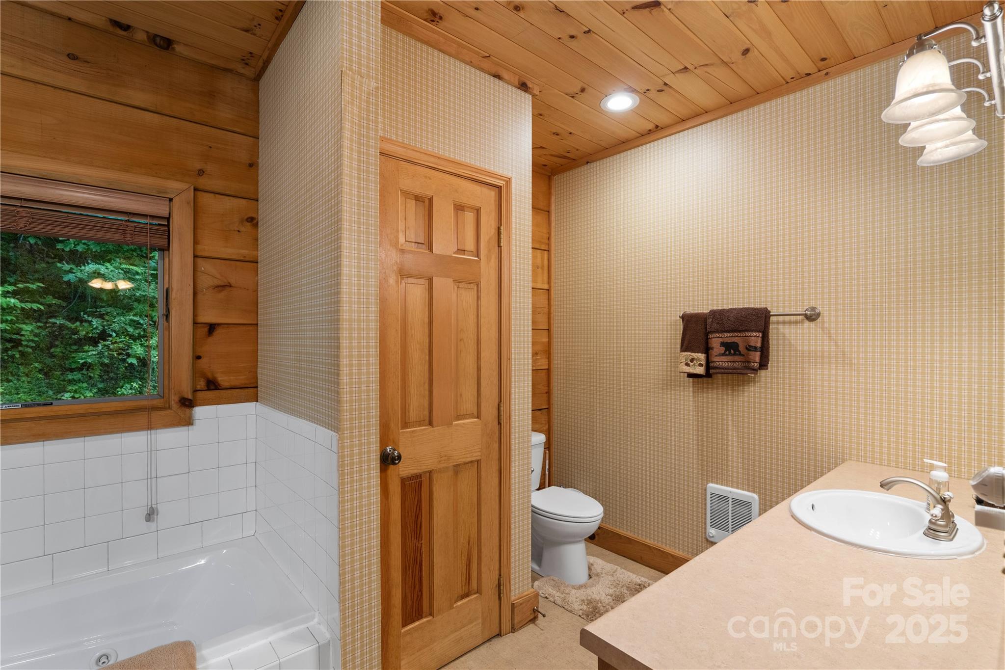 12215 Big Laurel Road Marshall, NC 28753 - Photo 15 of 44 a bathroom with a toilet sink and shower