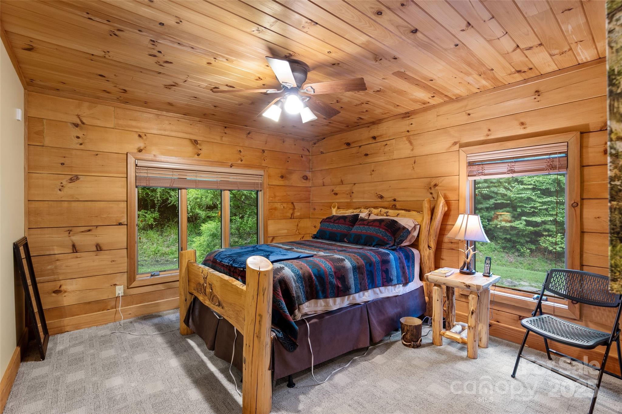 12215 Big Laurel Road Marshall, NC 28753 - Photo 18 of 44 a bed sitting in a room next to a window