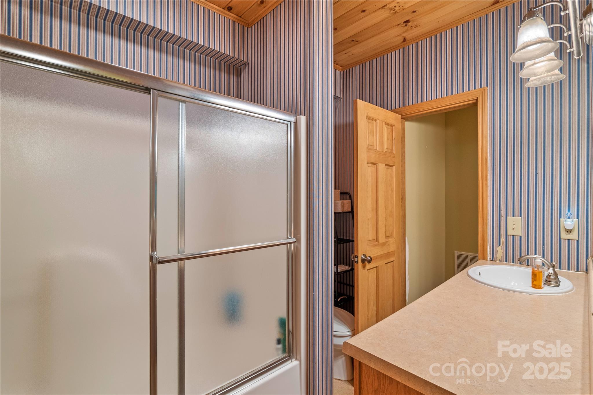12215 Big Laurel Road Marshall, NC 28753 - Photo 22 of 44 a bathroom with a bathtub and a shower