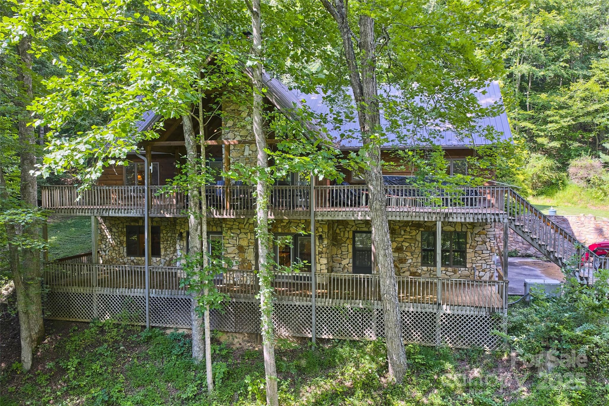 12215 Big Laurel Road Marshall, NC 28753 - Photo 29 of 44 front view of a house with a tree