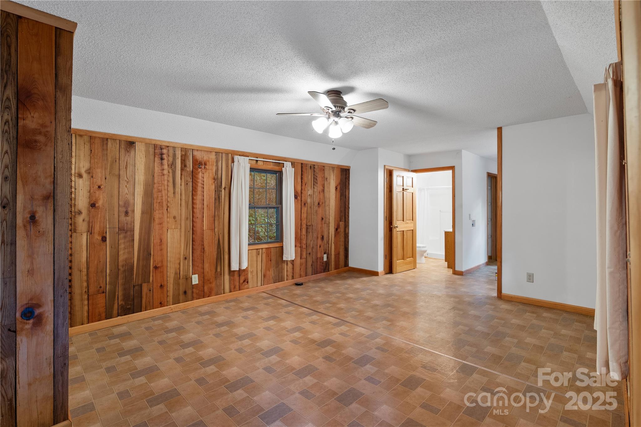 12215 Big Laurel Road Marshall, NC 28753 - Photo 34 of 44 a view of an empty room with a window