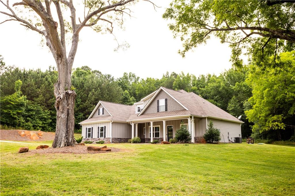 464 P P J East Road Covington, GA 30014 - Photo 1 of 1 a front view of a house with a yard